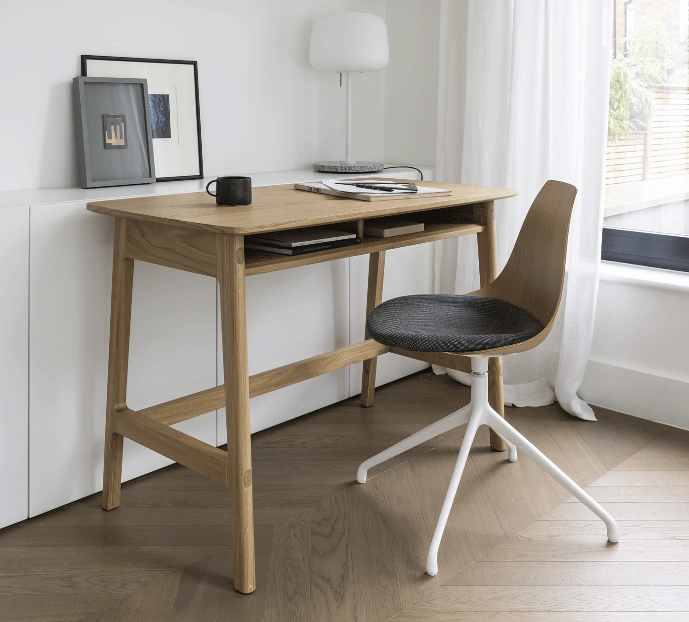 Dulwich Desk in Oak with a Ziba chair with oak shell and eleum fabric seat in a light and airy home office setting