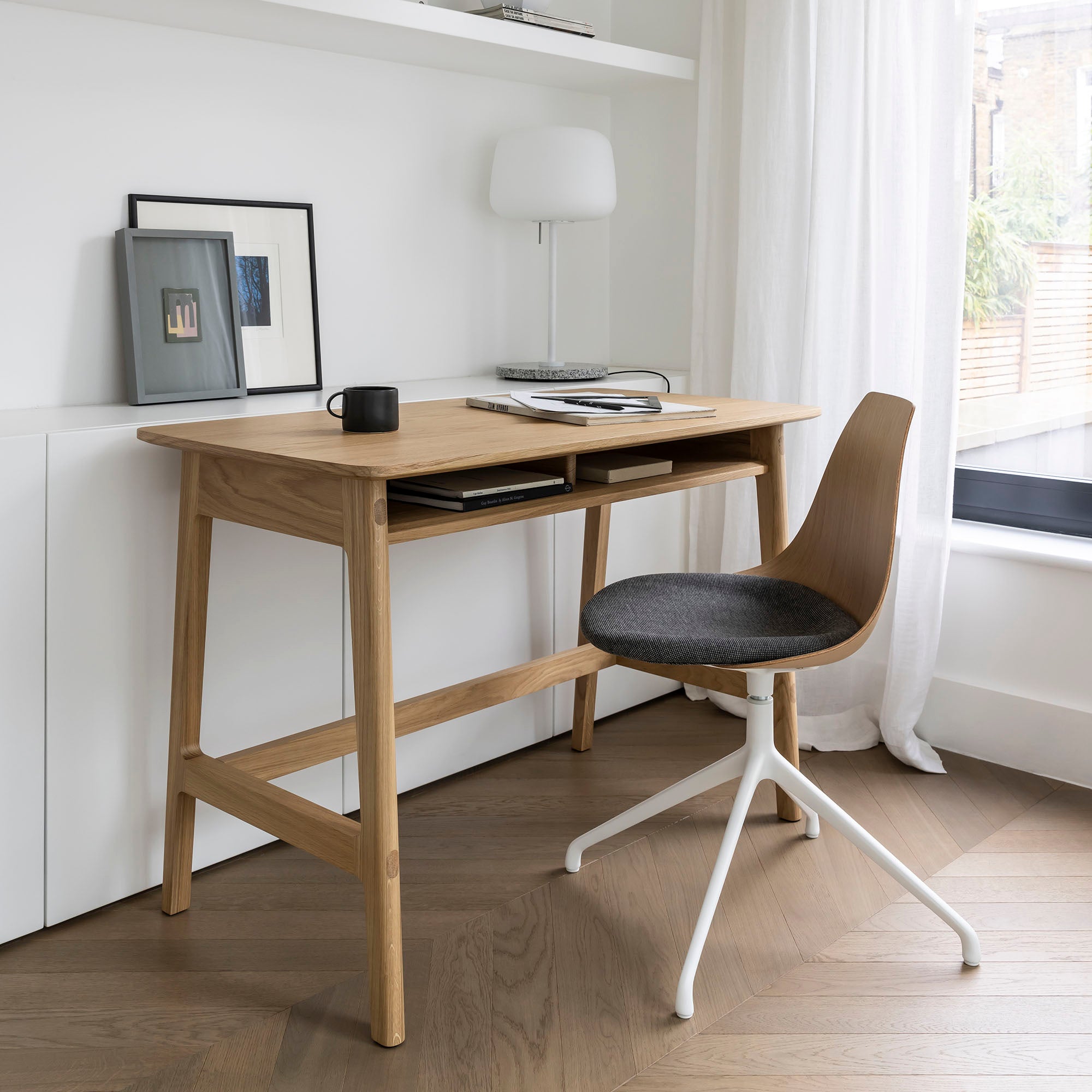 Dulwich Desk in Oak with a Ziba chair with oak shell and eleum fabric seat in a light and airy home office setting