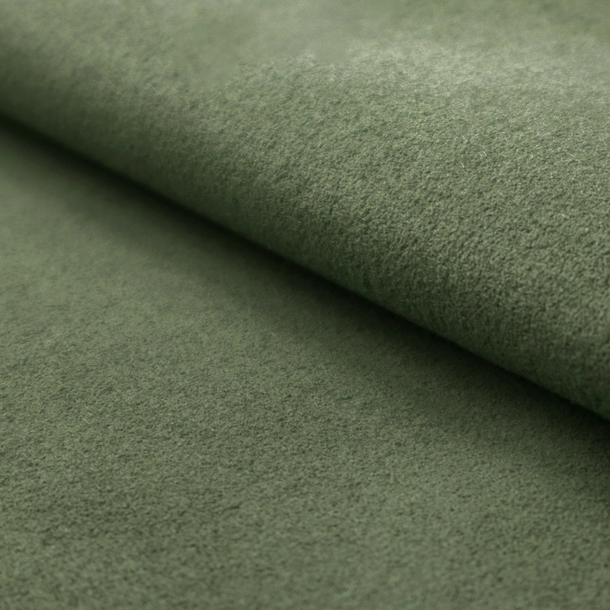A close-up of the Bottle Green colour Ultrasuede fabric with a soft, textured surface and a folded edge.