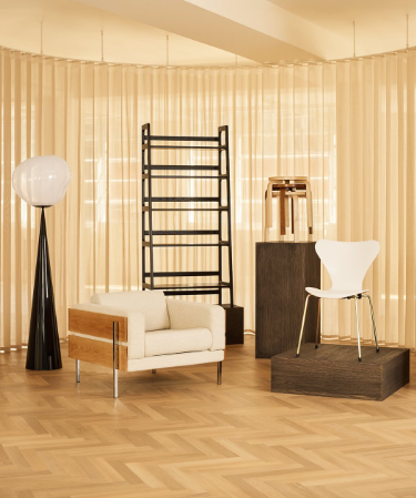 Forum Sofa Armchair in oak and chalk boucle alongside furniture from Tom Dixon, SCP, Artek and Fritz Hansen for Heals Design Milestones Celebration