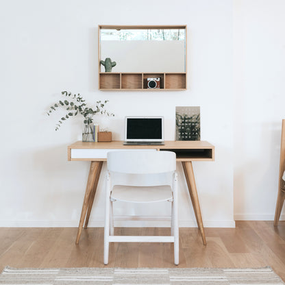 Oak Arca small Wall box on a white wall with a Celine desk in Oak and white below with a Narin Folding Chair in White.  