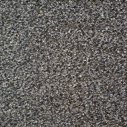 A close-up texture shot of a dense, tightly knotted Boucle fabric in a dark grey and black colorway | Case Furniture