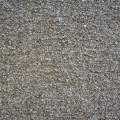 A close-up texture shot of a dense, tightly knotted Boucle fabric in a taupe-brown and gray colorway | Case Furniture