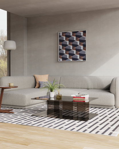 A modern living room scene featuring a light gray meris sectional sofa, a black glass coffee table, a black and white striped rug, and a geometric framed wall art piece on a warm gray wall.