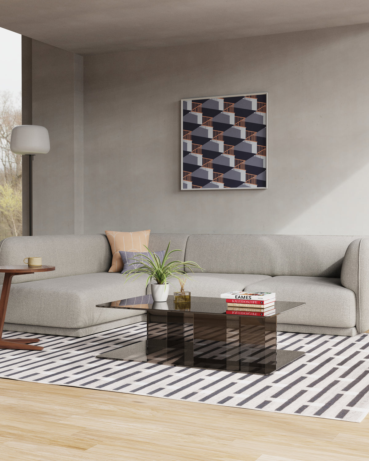 A modern living room scene featuring a light gray meris sectional sofa, a black glass coffee table, a black and white striped rug, and a geometric framed wall art piece on a warm gray wall.
