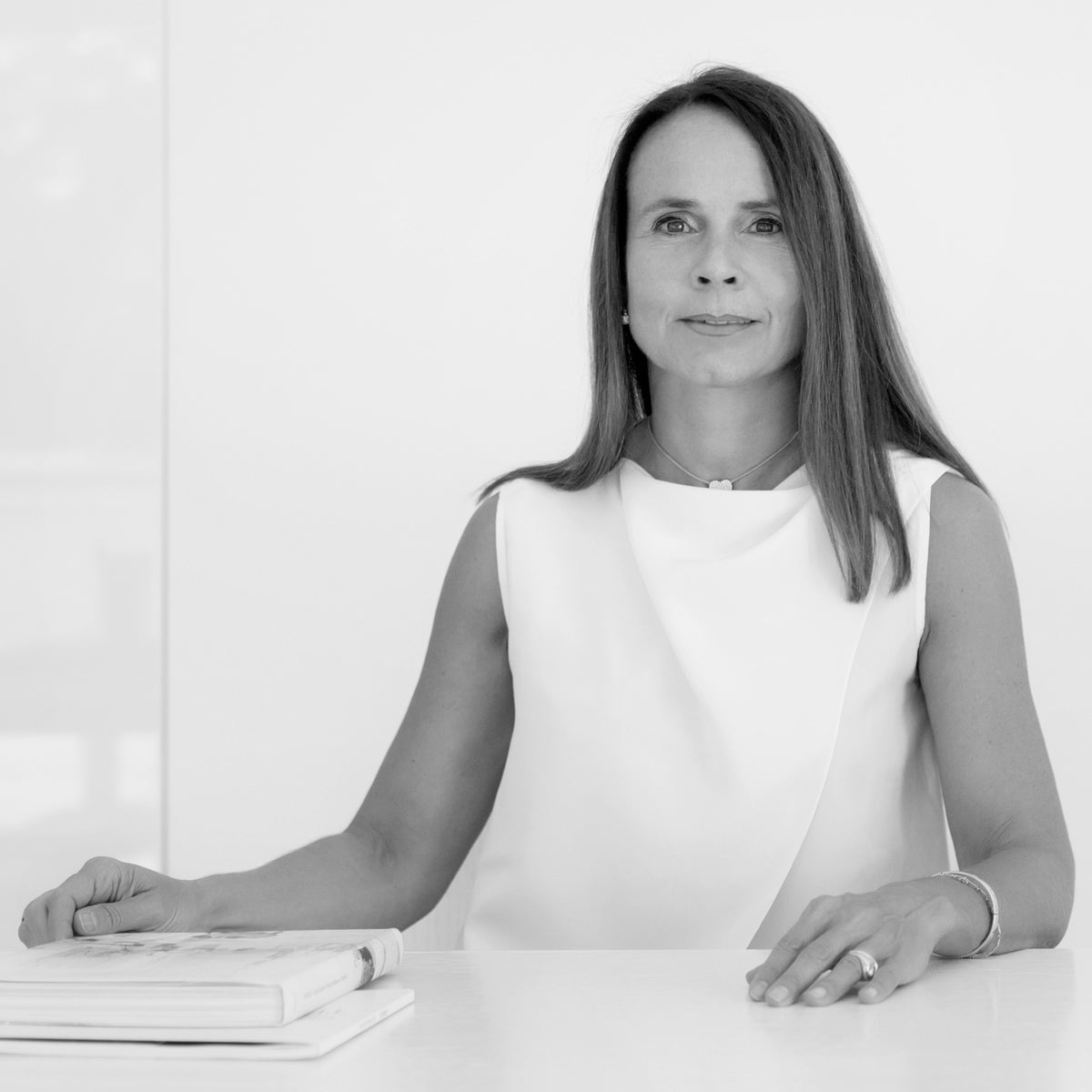 Monica Armani Portrait, looking focused in her studio in Black and White