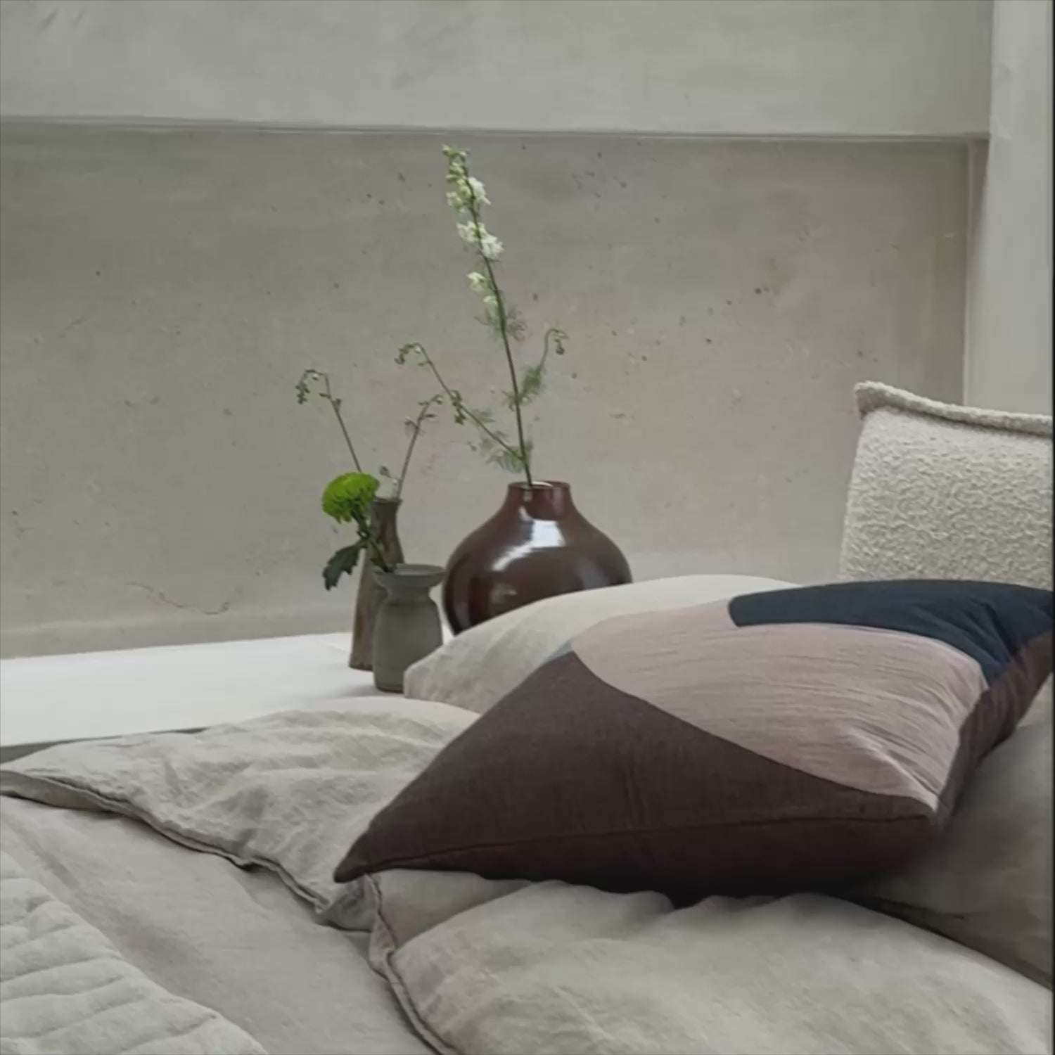 Somme Bed in Birch boucle, with Eclipse cushions and Solid Table Light