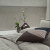 Somme Bed in Birch boucle, with Eclipse cushions and Solid Table Light