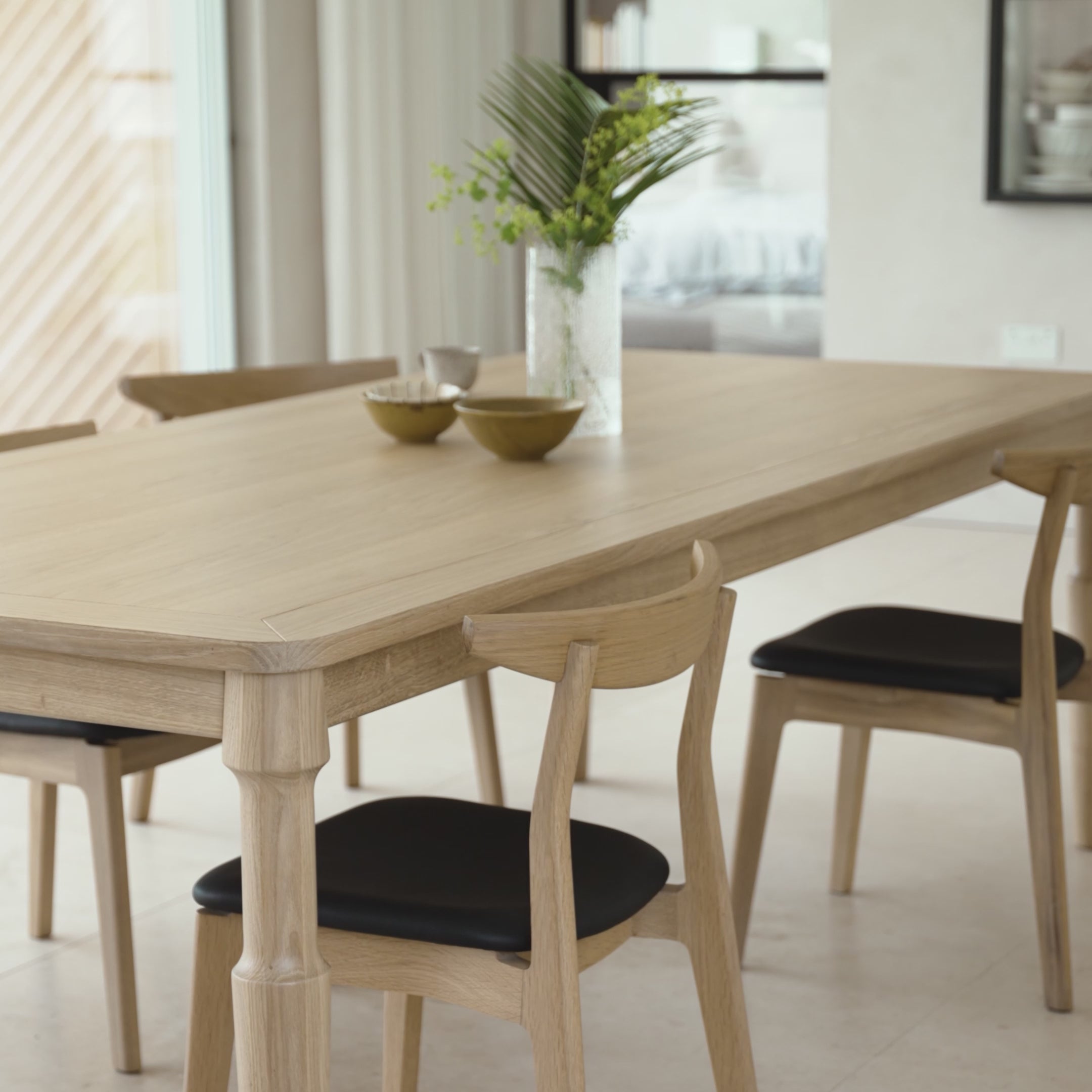 Load video: Video of the Dulwich Dining Chair in Oak with the Danbury Table in a minimal modern dining room. 