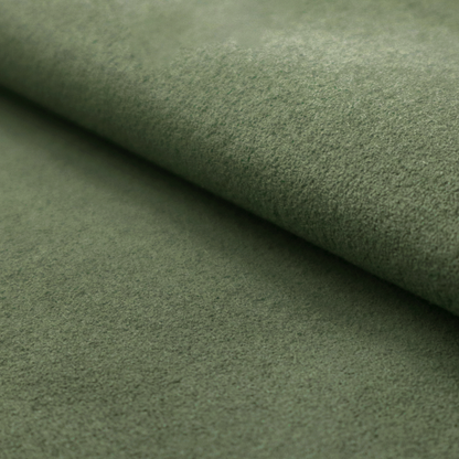 A close-up of the Bottle Green colour Ultrasuede fabric with a soft, textured surface and a folded edge.